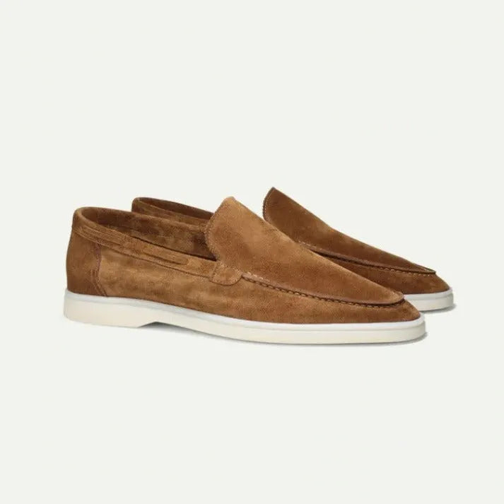 Men's matte suede flat shoes in sky blue with round toe and rubber sole on a plain background