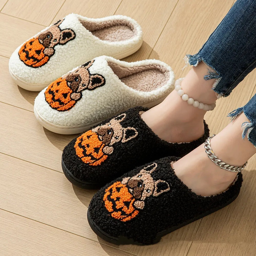 Black and white Halloween pumpkin plush house slippers with non-slip rubber soles.