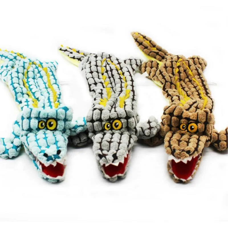 Crocodile-shaped plush dog toy with corduroy fabric detailing and squeaker inside