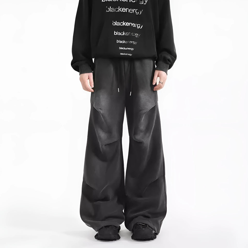 Men's pleated straight loose sweatpants in black and grey, cotton fabric, elastic waist, American washed finish.