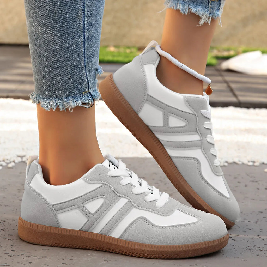 Women's low-top lace-up jogging shoes with a platform heel in khaki, grey, and black.