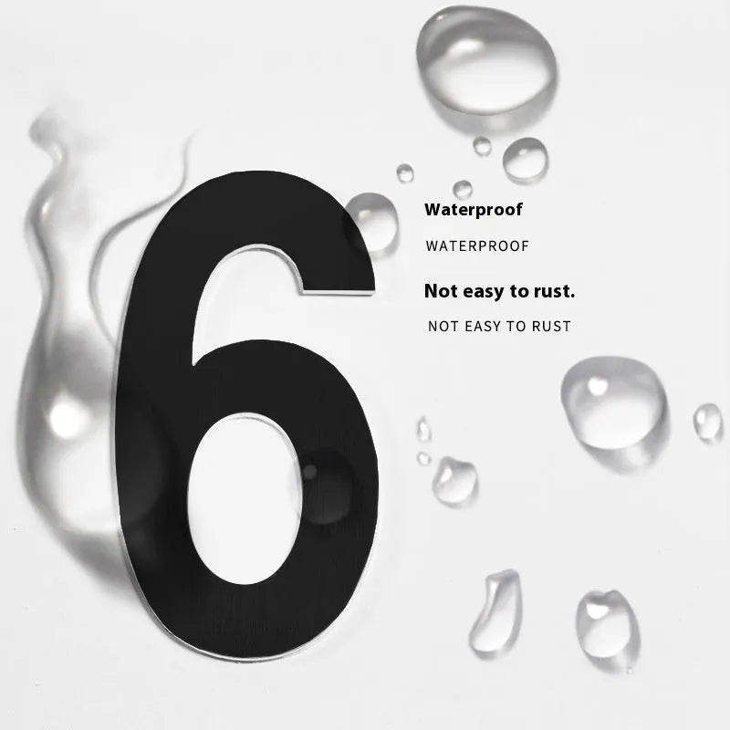 Black stainless steel sticky house numbers and letters, each 7.5cm high, on a white background.