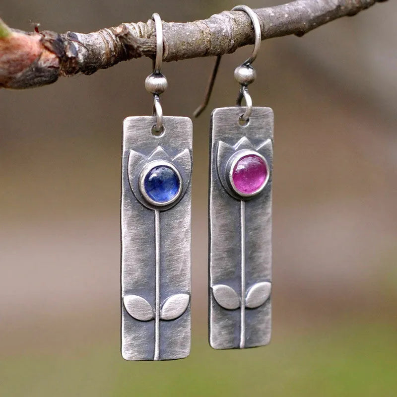 Antique finish red sapphire earrings with geometric shape and elliptic design elements