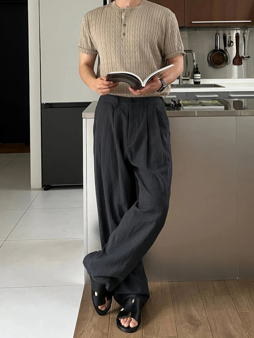 Army green men's casual drawstring waist trousers laid flat, showing the basic style and relaxed fit.