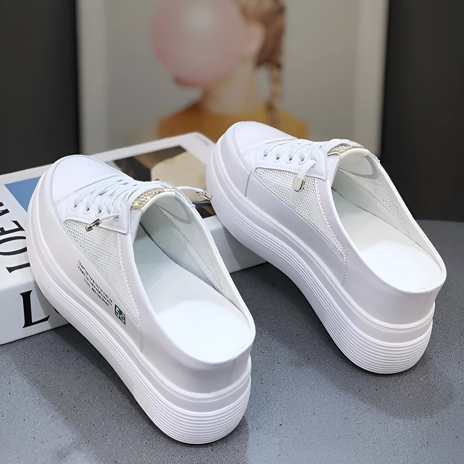 White women's casual platform shoes with mesh surface and heel-free design on a rubber sole.