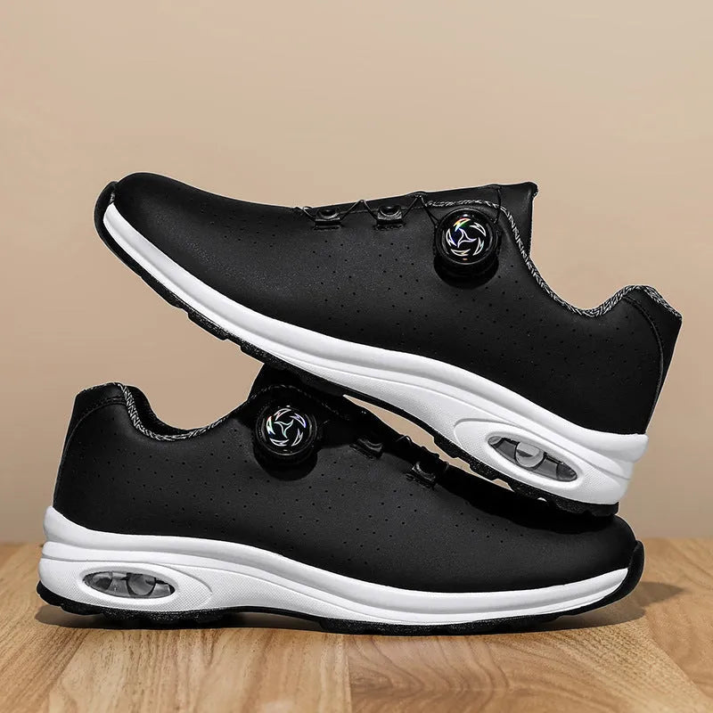 Men's black and white low-top mesh casual tennis shoes with lace-up front and cross straps.