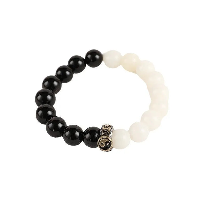 Black and white obsidian Tai Chi mantra bracelet with geometric woven beads