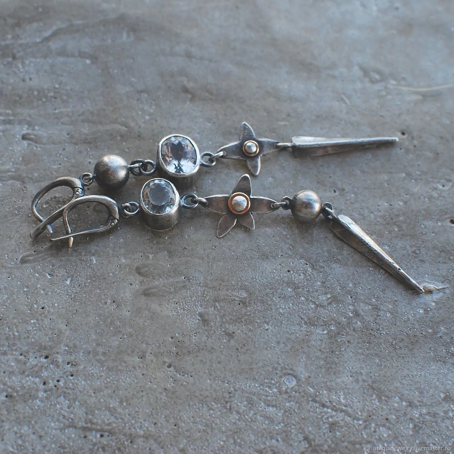 Geometric antique silver pendant earrings with rhinestone accents and long drop design