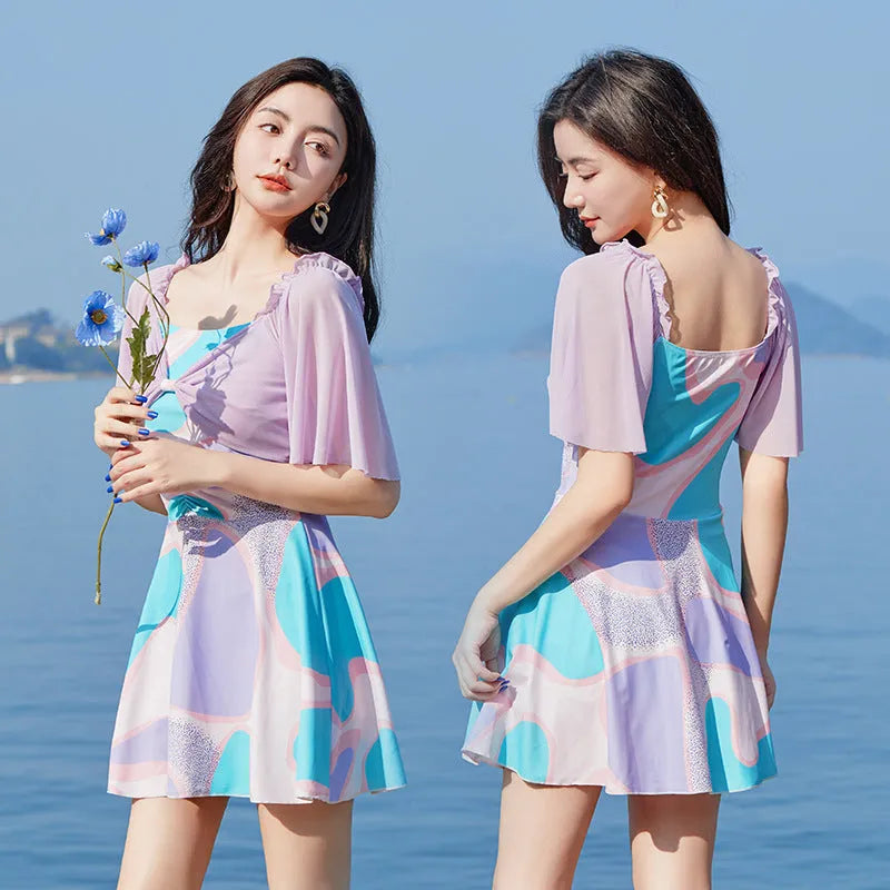 Light purple floral high-waisted one-piece swimsuit for women, laid flat.