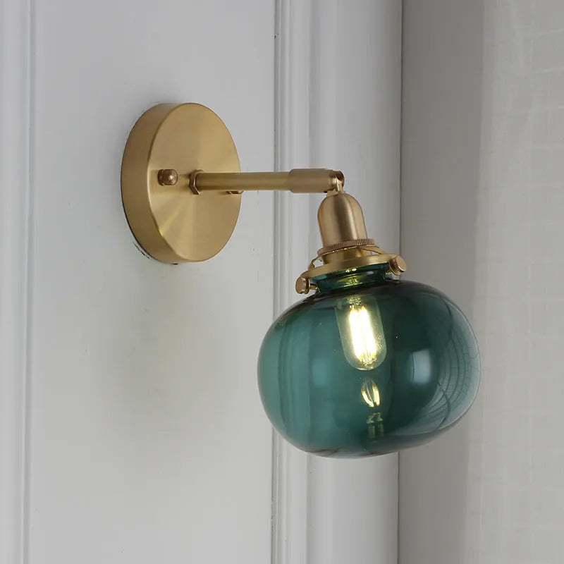 Pumpkin-shaped decorative glass wall lamp in water ripple, blue, or clear finish for living room or bedroom.