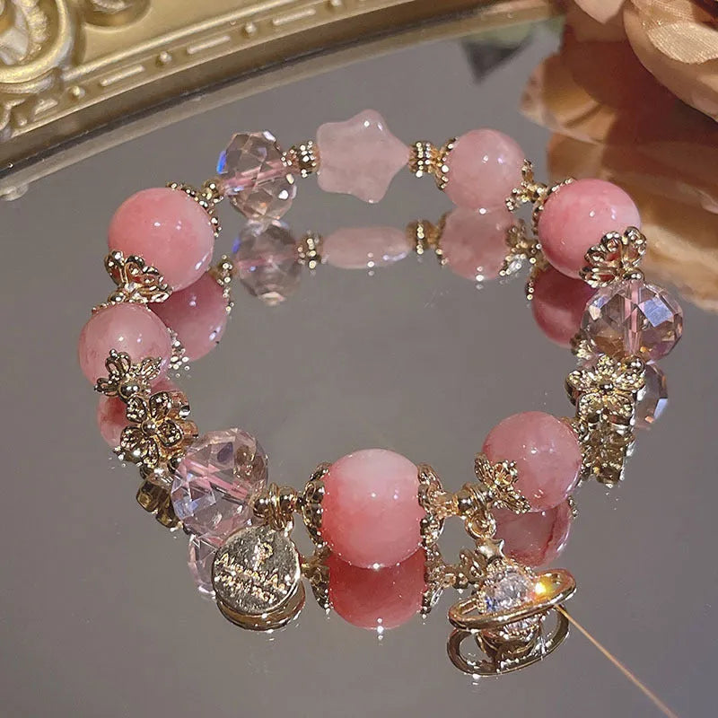 Women's galaxy colour bracelet with snowflake pendant, bow decoration, heart shapes and cartoon character details