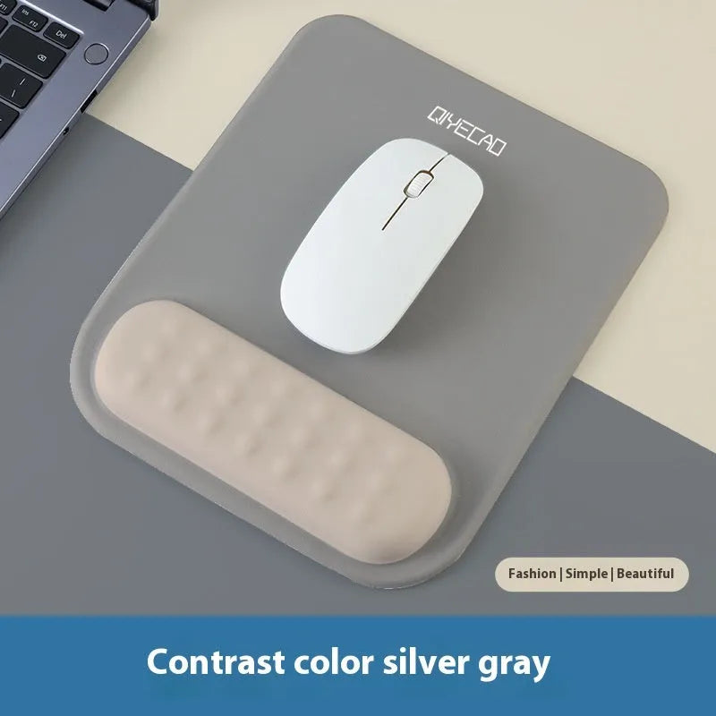 Ergonomic mouse pad with raised wrist support in a choice of contrast colour patterns on a desk.