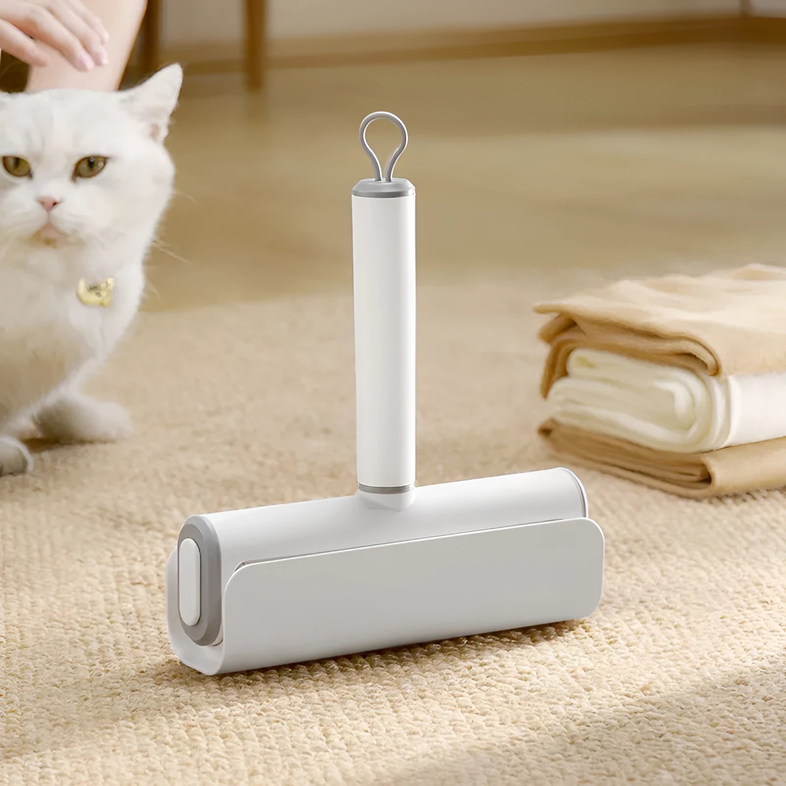 Refillable lint remover roller for picking up cat hair from floors and carpets