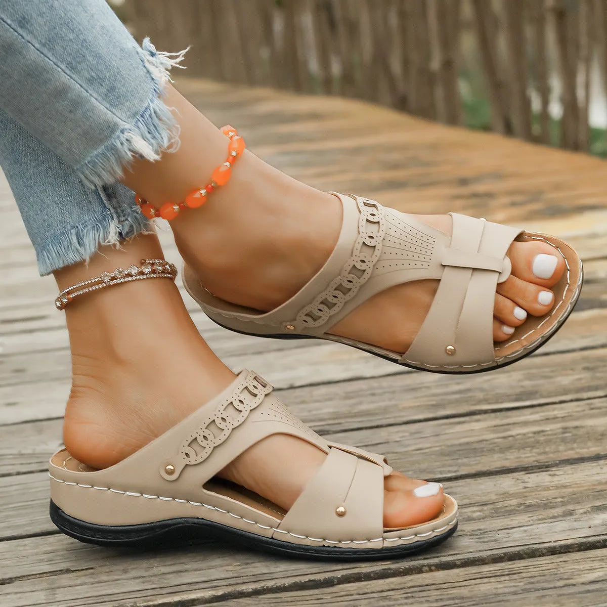 Roman-style slippers with a slope heel and fish mouth toe design in PU leather, shown in beige colour.