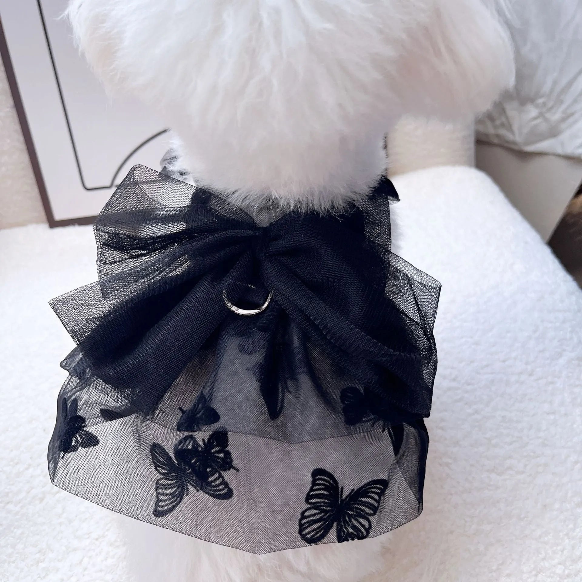 Black tulle princess skirt for a small dog or cat on a mannequin, showing layered gauze.