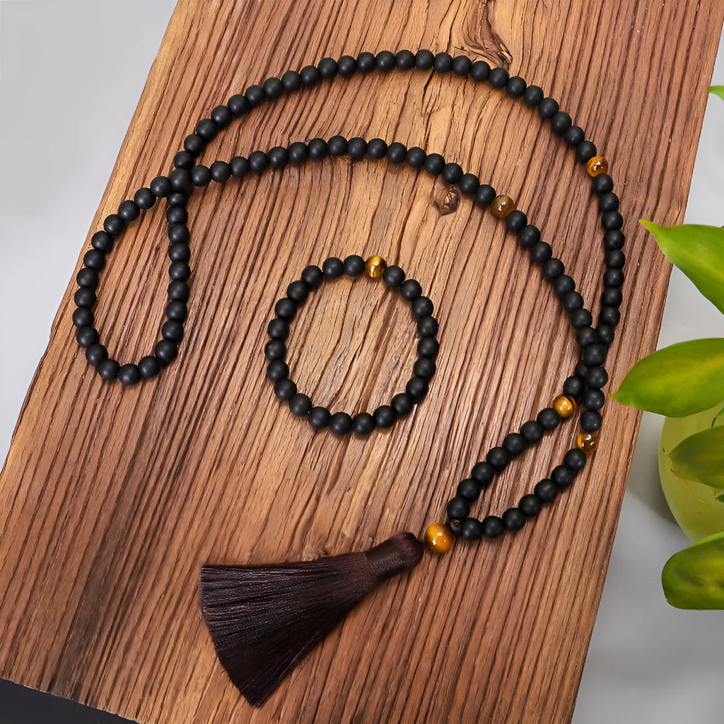 Tigereye stone drop pendant with tassel on long beaded necklace with matching bracelet.
