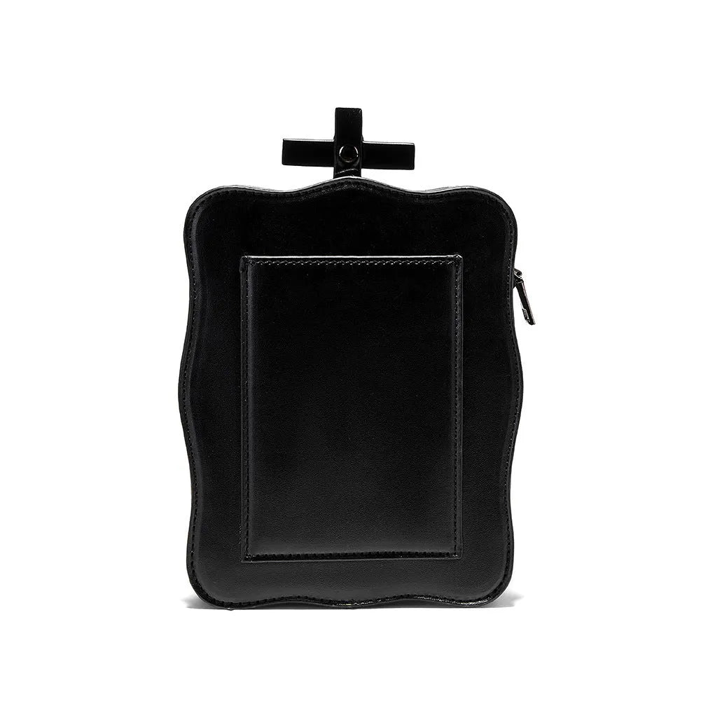 Black mini square shoulder bag with gothic skull design, embossed stitching detail, and chain crossbody strap
