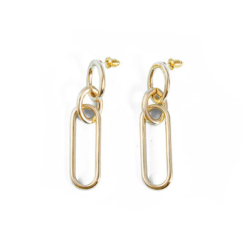 Women's sterling silver colour geometry hoop earrings showing ring and line design elements
