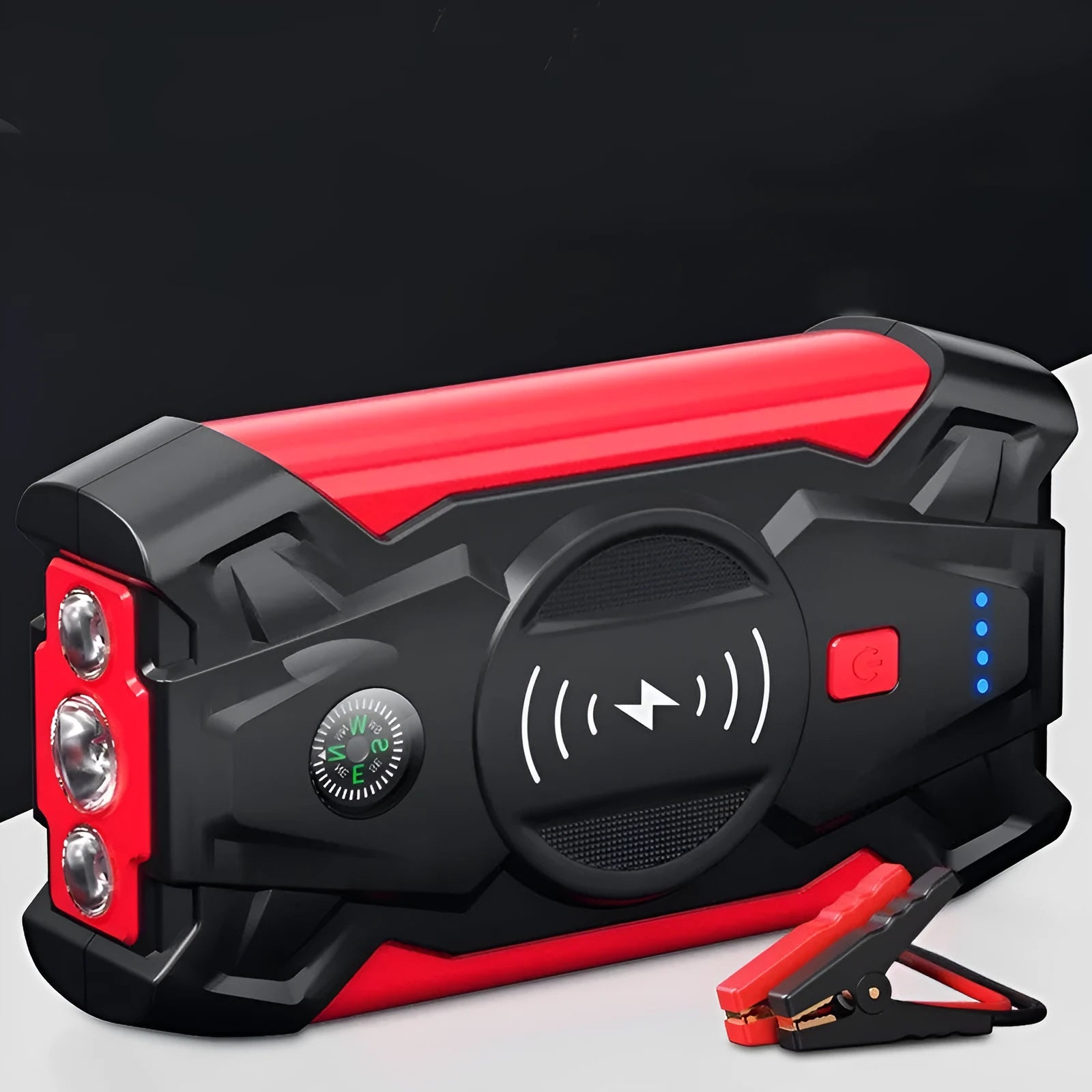 Red car emergency jump starter power pack with connection clips on a black background