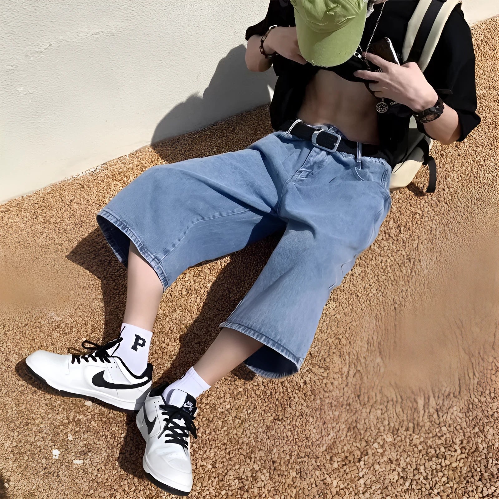 Men's blue thin denim pirate shorts with a high waist and cropped length on a hanger.