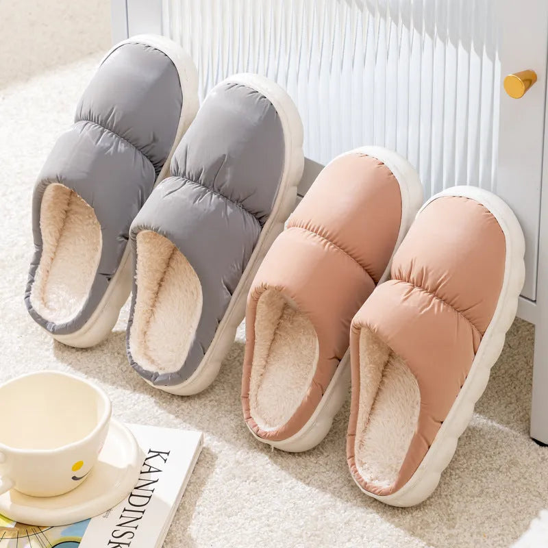Blue down cotton slippers with thick rubber sole and plush lining, shown from side.