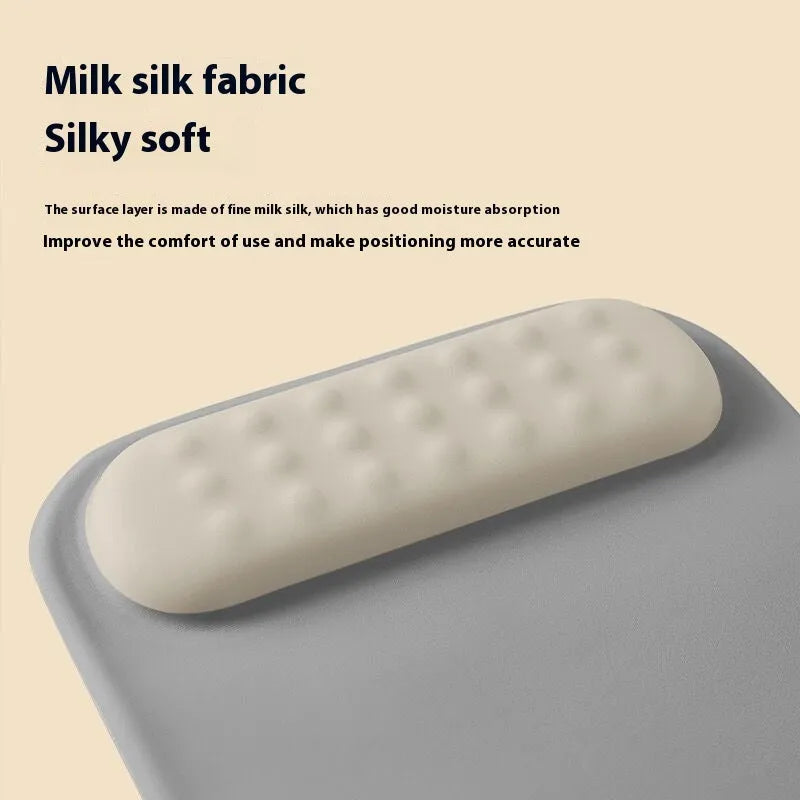 Ergonomic mouse pad with raised wrist support in a choice of contrast colour patterns on a desk.