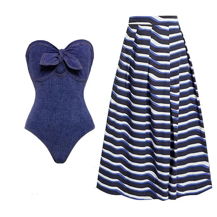 Women's vintage denim-colour one-piece swimsuit with a matching skirt laid flat.