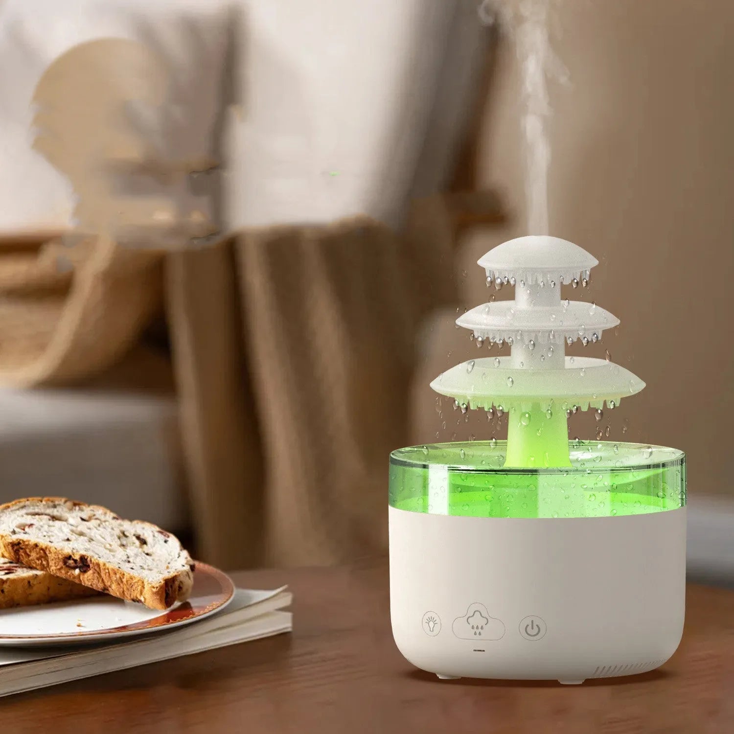 White cloud-shaped ultrasonic humidifier and essential oil diffuser with colourful LED light on base.