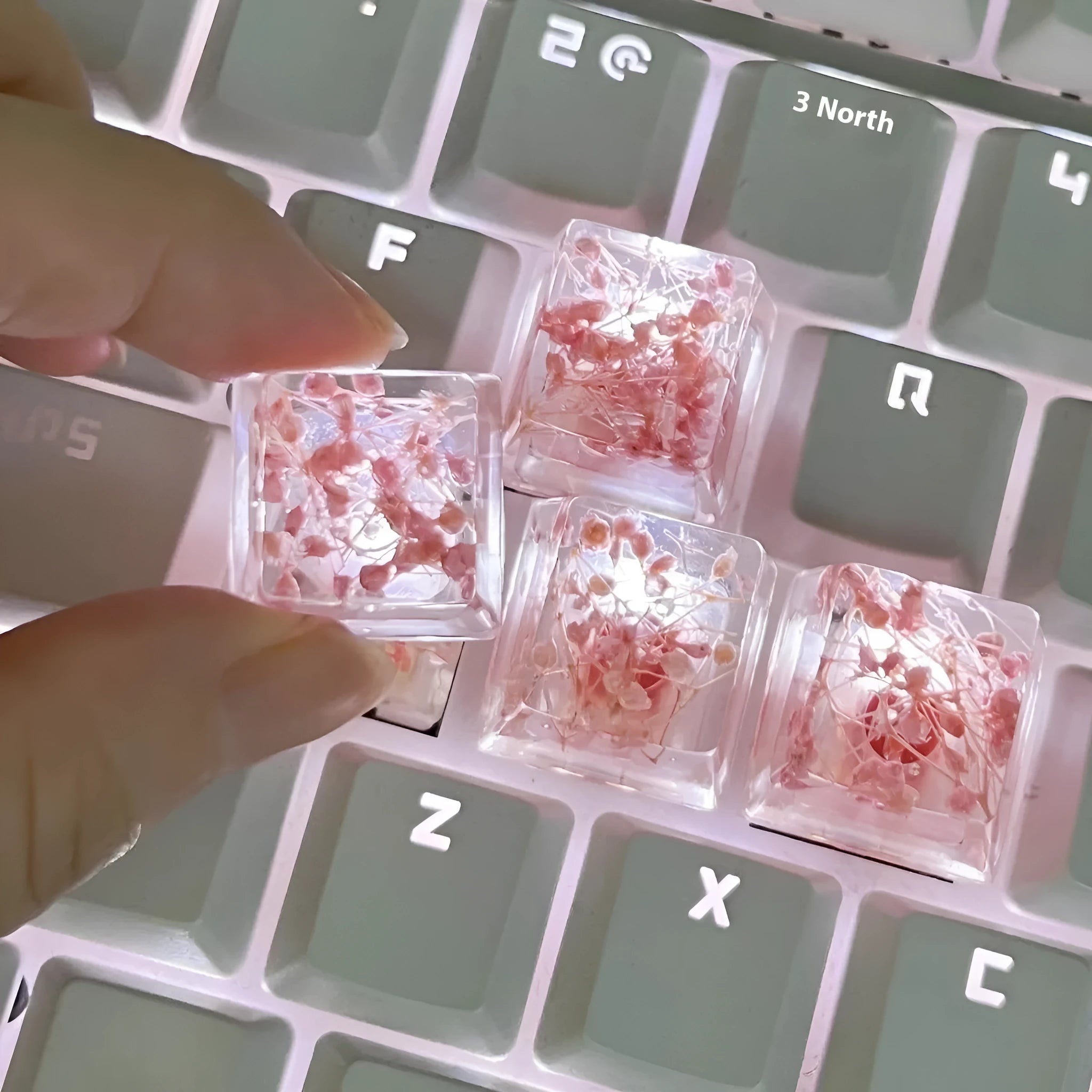 High-transparency starry sky design resin artisan keycap for mechanical keyboards, shown in green colour.