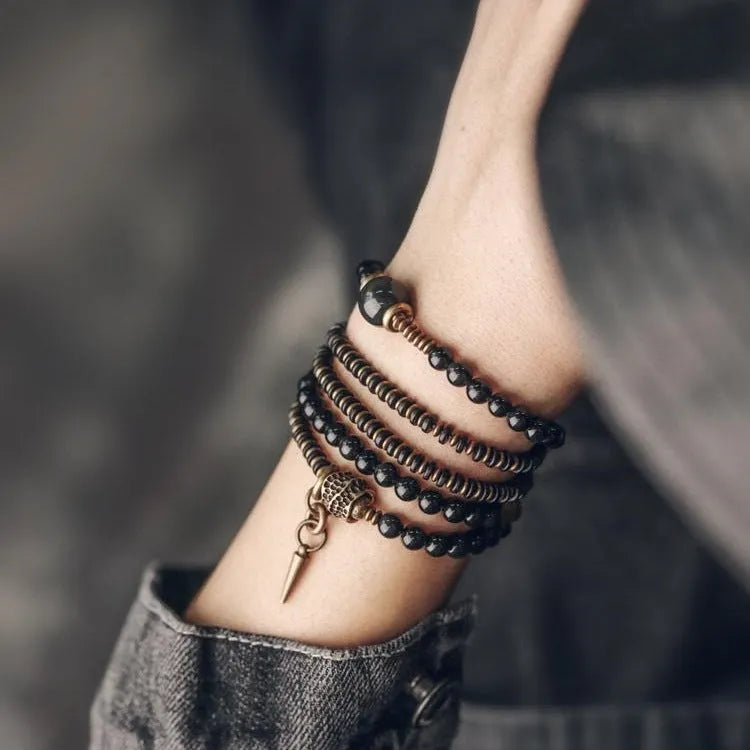 Black geometric beaded bracelet with multi-layered construction