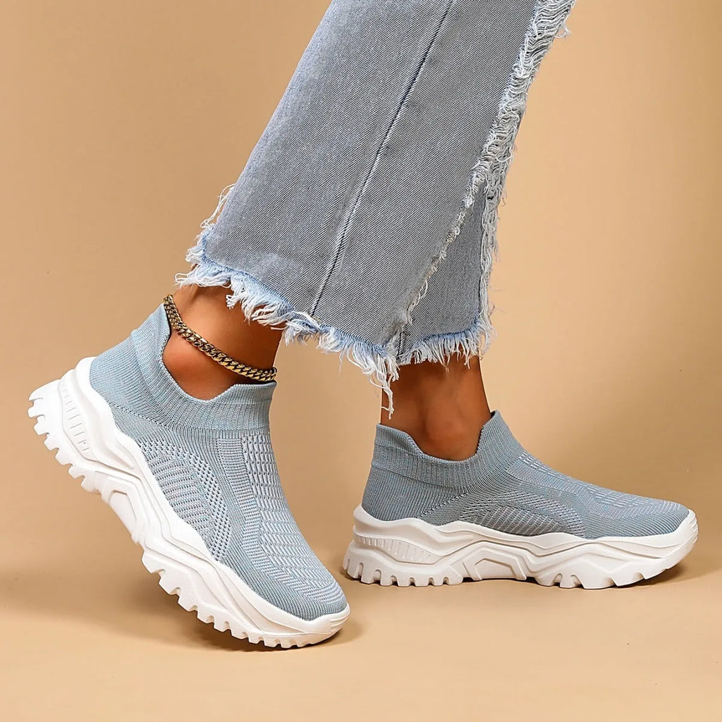 Light blue women's mesh slip-on sports shoes with woven upper and mid heel design