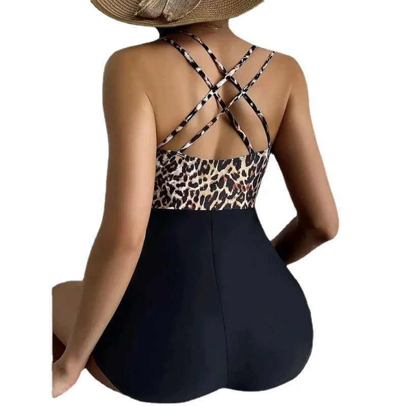 Women's one-piece swimsuit with leopard print, cross lace-up front, and slimming hip design