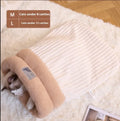 Brown semi-enclosed plush pet sleeping bag for cats on a wooden floor