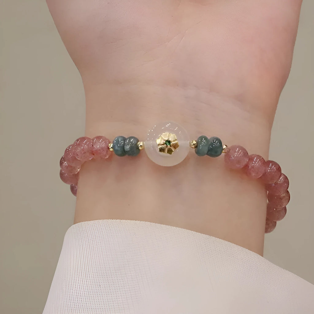 Strawberry quartz and blue water emerald pendant bracelet with round jade centrepiece and geometric diamond elements