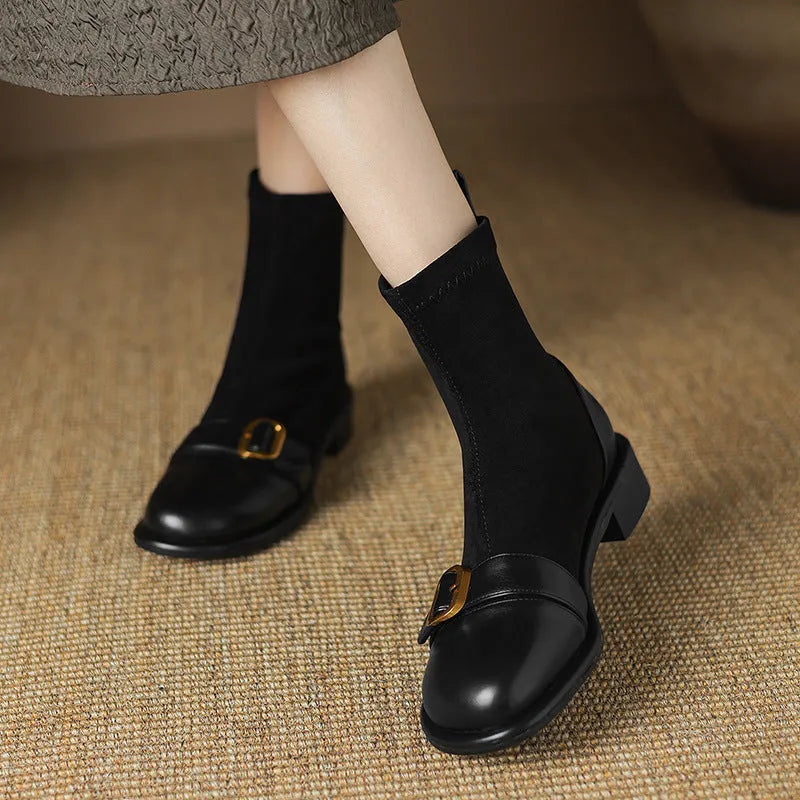 Women's black low heel ankle boots with lace-up front and decorative belt buckle stitching