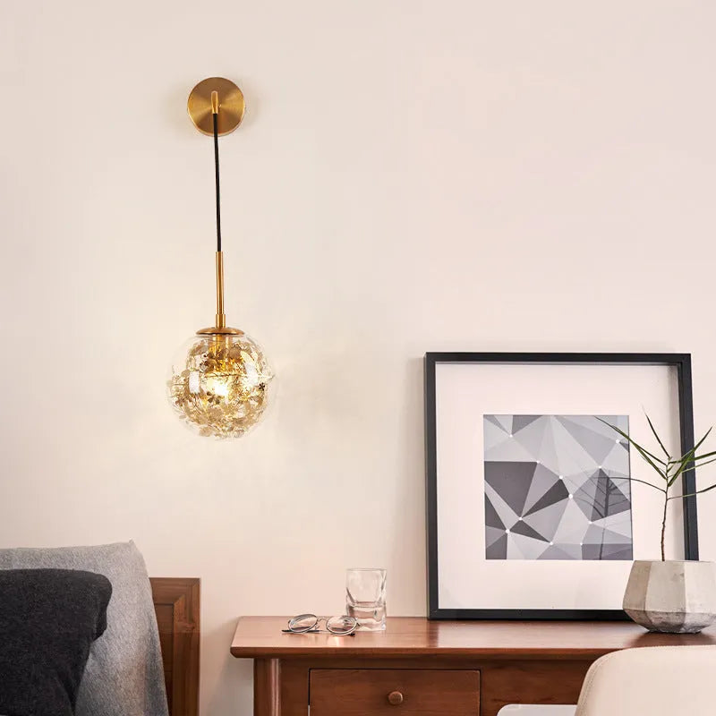 Modern glass wall lamp in golden flower or silver flower finish, shown in 15cm and 20cm sizes.
