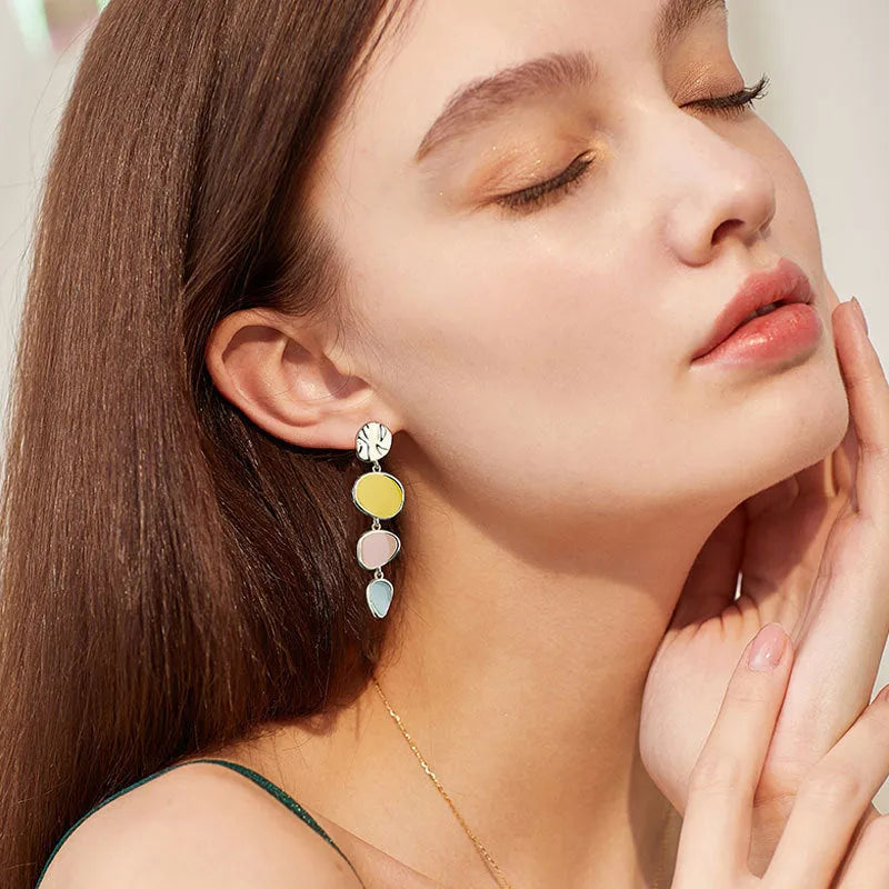 Sterling silver finish Morandi three-colour drip oil wafer disc earrings.
