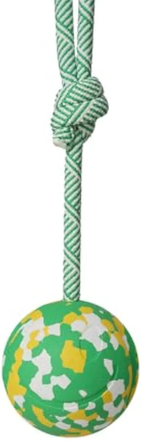 Dog toy featuring a natural rubber ball attached to a nylon rope for fetch and tug games.