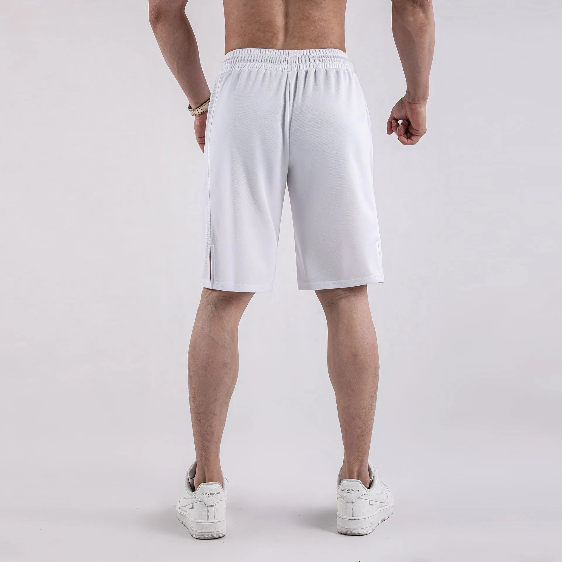 Men's black quick-drying mesh sports shorts with a loose fit and elasticated waist.