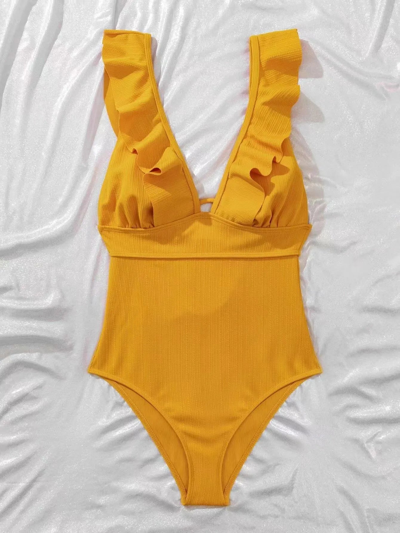 Women's one-piece swimsuit with ruffled shoulders, adjustable straps and back lace design in solid colour