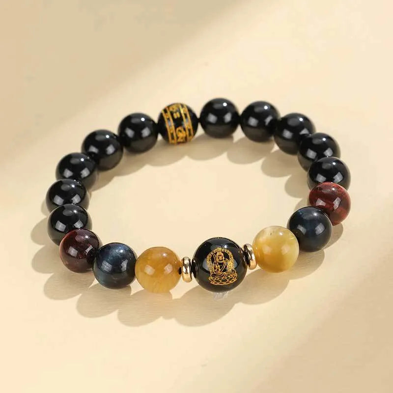 Manually crafted black agate beaded bracelet with gold, blue, and red tiger eye stones, showing ethnic zodiac design.