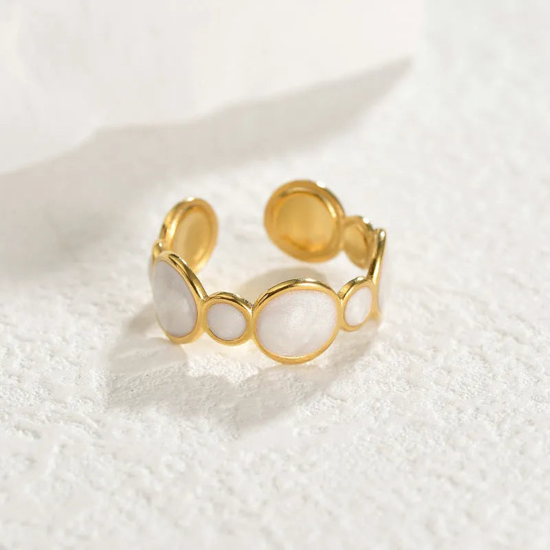Adjustable geometric stainless steel ring with an electroplated finish for women.