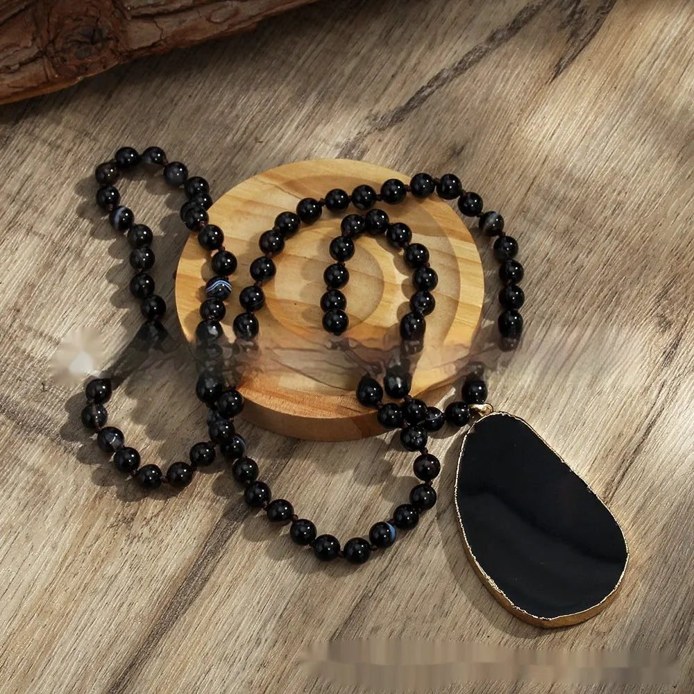 Bohemian handmade necklace with natural stone beads in brown, irregular agate pendant and knotted chain