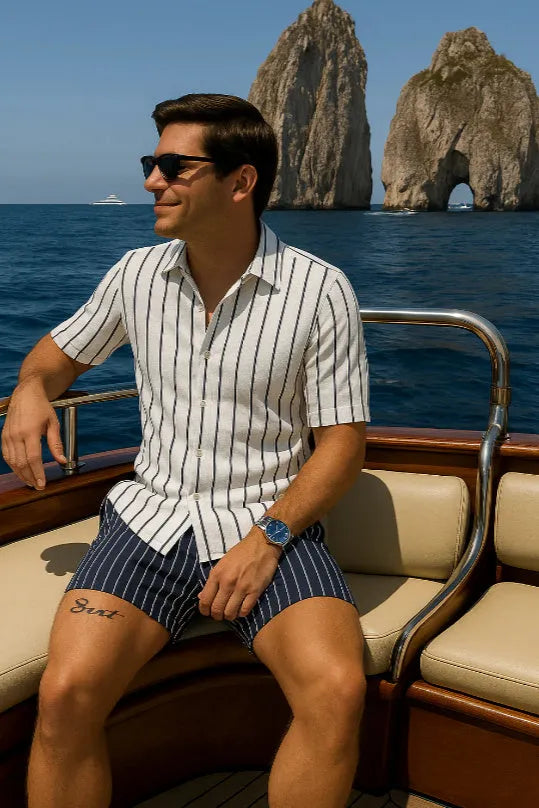 Man wearing a light mature casual beach shirt and shorts set in four-sided elastic fabric.
