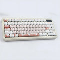 Set of colourful cartoon dessert cat themed key caps for mechanical keyboards on a white background.