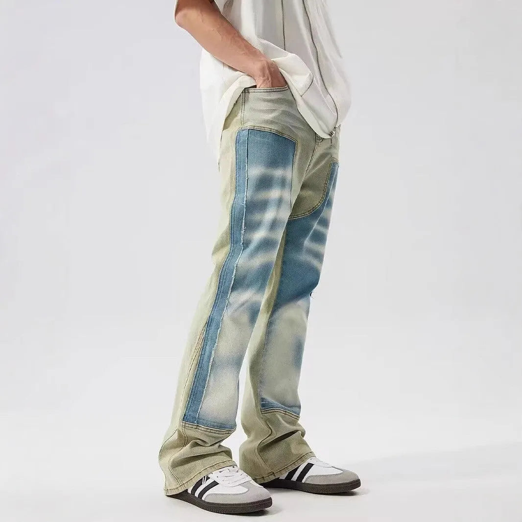 Yellow and blue retro patchwork splash-ink distressed design jeans on a mid-waist.
