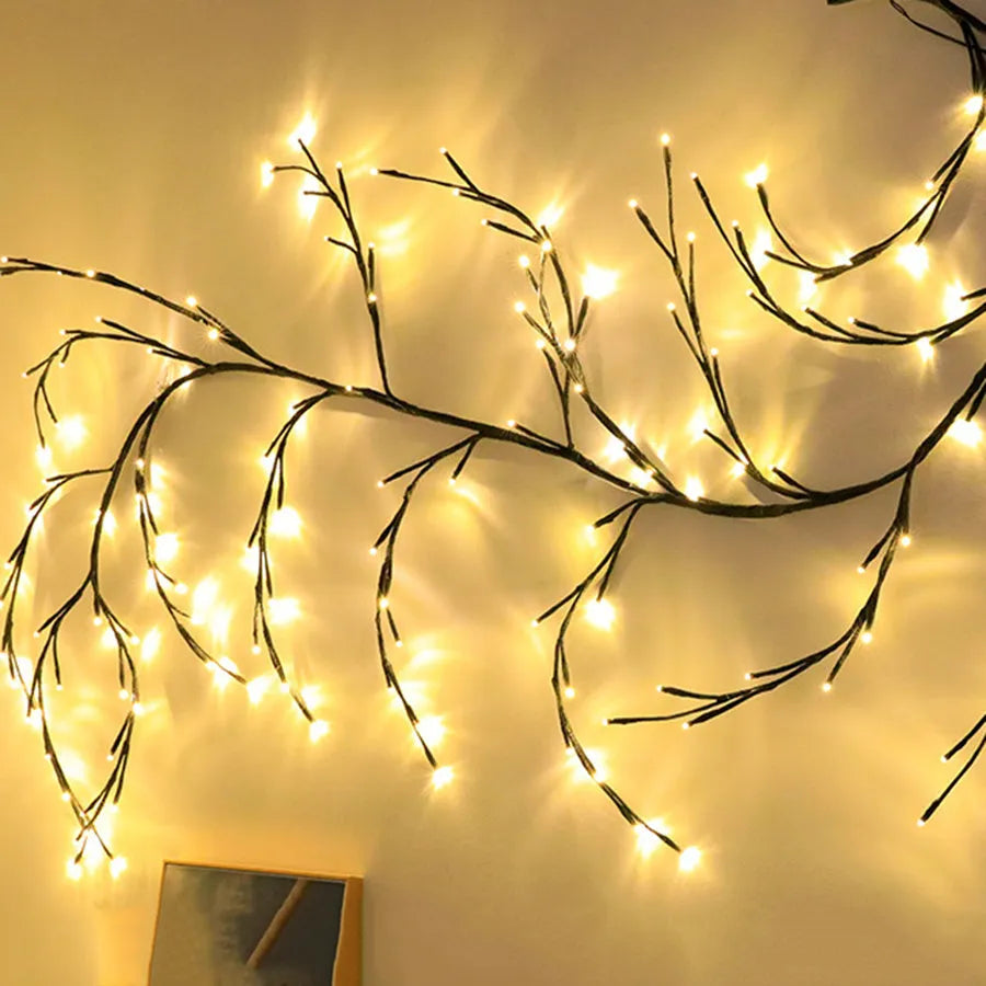 Flexible LED vine garland with warm white lights on birch bark texture branches