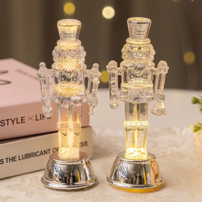 Transparent plastic walnut soldier nutcracker Christmas ornament 9.5cm tall on desktop