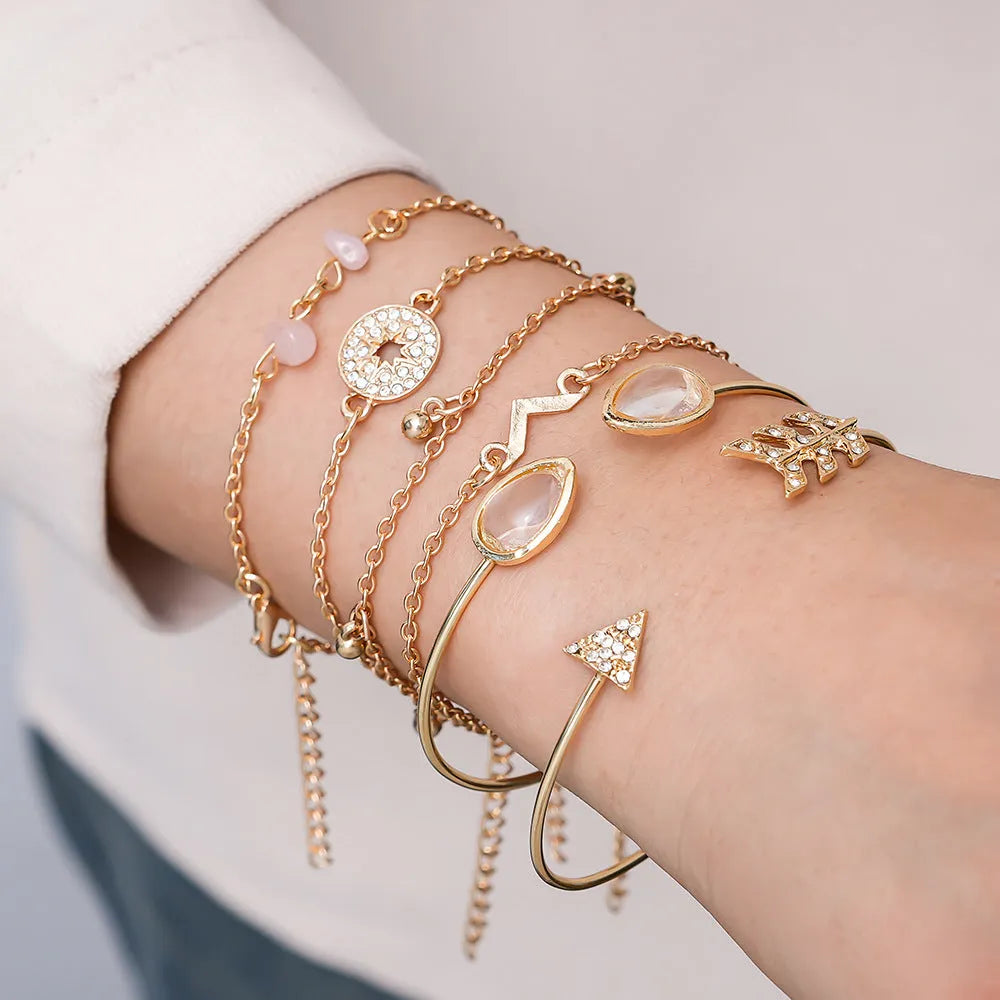 Gold-coloured zinc alloy women's bracelet set with six European-inspired designs including water drop and arrow shapes