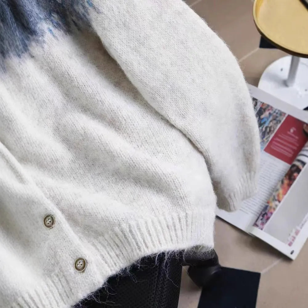 Women's loose-fitting jacquard knit sweater coat in a contrast colour pattern.